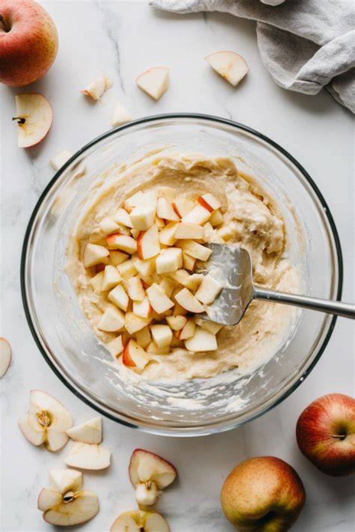 Apple cake batter in a large bowl.