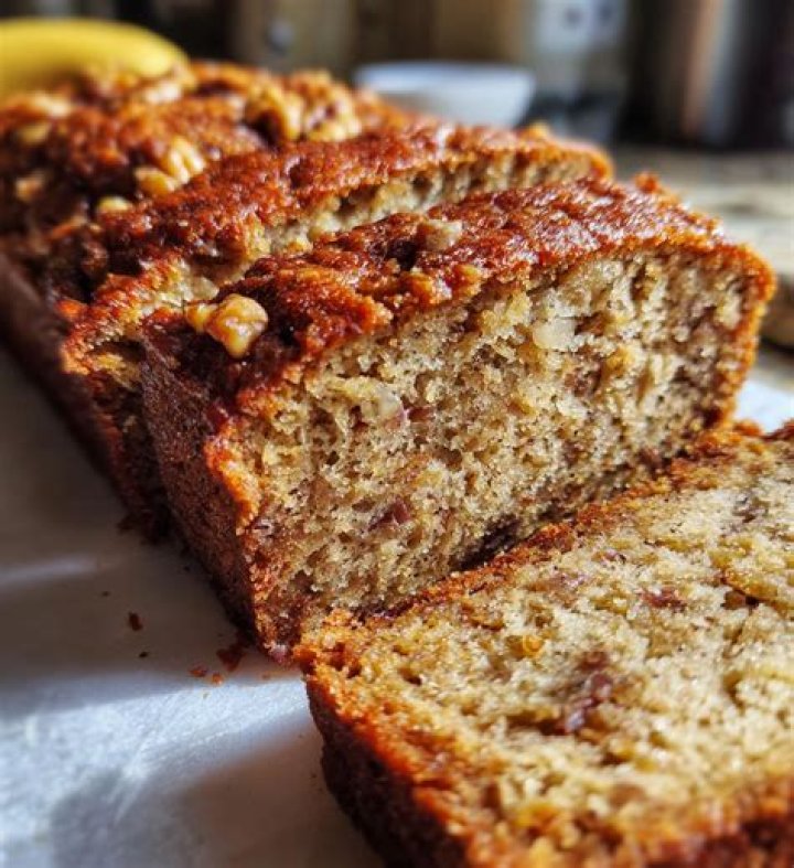 Closeup of banana nut bread in a loaf pan.
