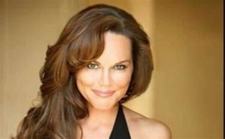 Delaina Mitchell with a brown hair poses at the camera.
