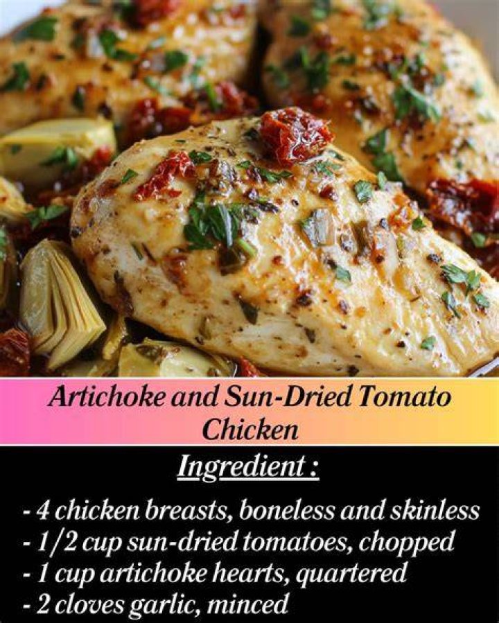 Sun dried tomato and artichoke dip in a white bowl. 